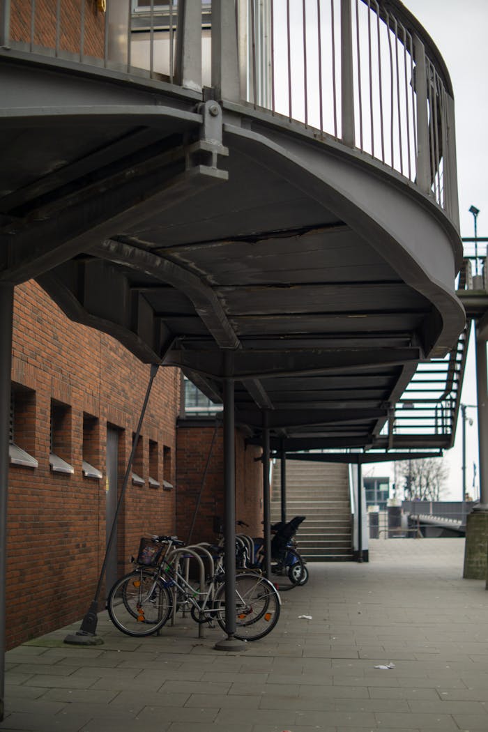 A modern architectural view of a pedestrian bridge in Hamburg with parked bicycles.
